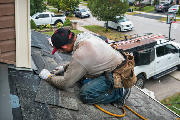 Professional Roof Replacement technician working in North Bay, NY